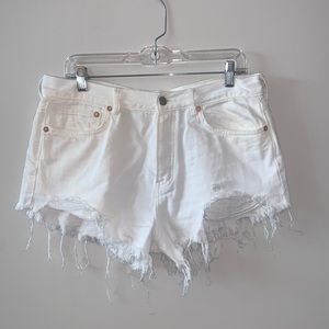 Distressed white denim free people mid rise shorts. Size 30.